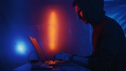 Wall Mural - hacker is working on laptop at night. hands are typing a virus code at keyboard or hacking website. 