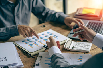 team work process Businessman working in the office discussing paperwork and working on financial reports. Talk about an investment business plan. financial analysis concept