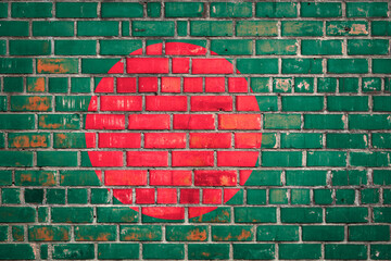 Wall Mural - Bangladeshi flag flag on a grunge brick background.