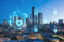 Illuminated Aerial Cityscape Of Seattle, Downtown At Night Time, Washington, USA. The Concept Of Cyber Security To Protect Confidential Information, Padlock Hologram