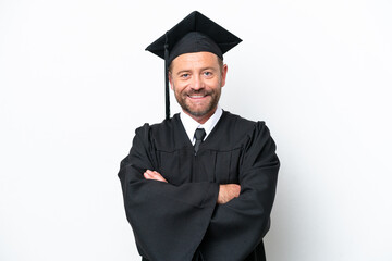 Wall Mural - Middle age university graduate man isolated on white background keeping the arms crossed in frontal position