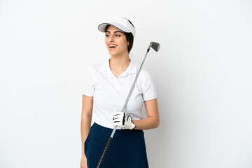 Wall Mural - Handsome young golfer player woman isolated on white background looking to the side and smiling