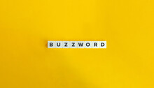 Buzzword Word On Block Letter Tiles On Yellow Orange Background. Minimal Aesthetics.