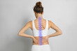 © New Africa - Woman with healthy spine on light background, back view