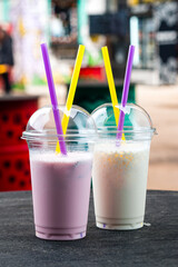 Canvas Print - two milkshakes with banana and strawberry, vanilla milkshakes