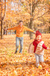 © marseus - Happy father and daughter enjoying autumn. Happy father and daughter having fun in autumn park