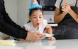 © atitaph - Happy family, parents celebrate the birthday of their cute little daughter