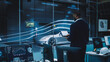 © Gorodenkoff - Engineering Research Agency Perform Aerodynamic Testing with a Modern Eco-Friendly Electric Sports Car in a Wind Tunnel. Professional Scientist Works on a Laptop Computer and Changes Testing Options.