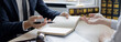 © Puwasit Inyavileart - Attorney or judge provides legal advice to the client in the courtroom, Ethics in the courts include justice and impartiality, legal consultant, scales of justice, law hammer, Litigation and justice.
