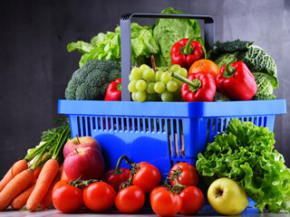 Wall Mural - Fresh organic fruits and vegetables in plastic shopping basket