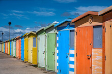 Colourful Beach Huts At The Promenade At Seaford In East Sussex.
