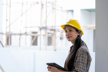 Aufkleber - Architect woman using tablet while working in the construction site.