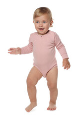 Poster - Cute baby girl in pink bodysuit learning to walk on white background