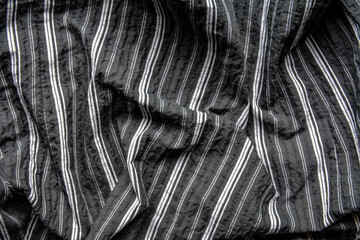 Fragment of a striped fabric .