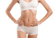 © Pixel-Shot - Young tanned woman in underwear on white background, closeup