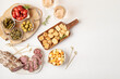 © netrun78 - Appetizers table with different antipasti, charcuterie, snacks, cheese. Finger food for buffet party. Traditional french or italian entires. Top view