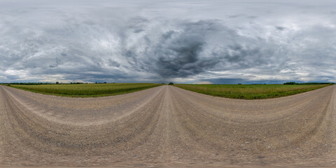 Wall Mural - full seamless spherical hdri 360 panorama view on no traffic gravel road among fields with awesome c