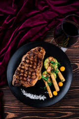 Wall Mural - Grilled striploin steak with spices and herbs, strip steak New York strip.