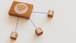 © RocknRoller Studios - Wireless Technology Concept with wifi Symbol on a Wooden Block. User Network Connections are Represented with Blue string. White background. 3D Render.