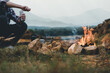 © KL 1981 - Bonfire in camping of people camper group in nature near the mountains with coffee brewing equipment.