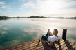 © Westend61 - Mature man looking at scenic view from pier