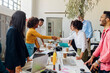© Westend61 - Smiling businesswomen shaking hands in office meeting