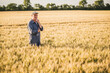 © Westend61 - Thoughtful senior farmer standing in farm