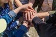© Milena - People put their hands together. Selective focus.