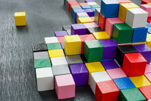 Lots Of Colorful Cubes On The Dark Surface. Variety Abstract Concept.