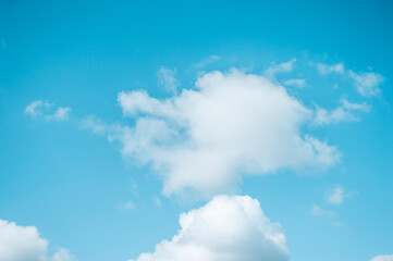 Wall Mural - Blue sky with white fluffy clouds Nature background