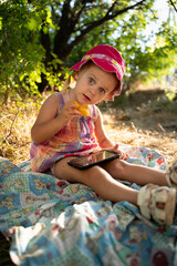 Wall Mural - Baby girl plays in nature