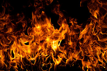 Fire flames isolated on black background. Fire burn flame isolated, flaming burning art design concept with space for text.