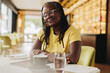 © Jacob Lund - Mature woman with dreadlocks sitting in a cafe