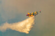 Fire plane spraying water at Geraneia mountain to eliminate the fire.