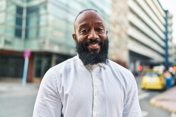 Poster - Young african american man smiling confident standing at street