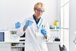 © Krakenimages.com - Young caucasian man wearing scientist uniform using pipette at laboratory