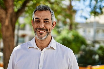 Sticker - Middle age grey-haired man smiling happy standing at the city.