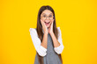 © Olena - Shocked teenager child girl portrait isolated on yellow background. Excited face. Amazed expression, cheerful and glad.