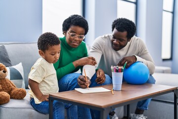 Sticker - African american family drawing on notebook at home