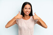 © kues1 - hispanic pretty woman smiling broadly looking happy, positive, confident and successful, with both thumbs up