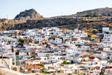 Fototapeta Miasto - Traditional white buildings at town Lindos in Rhodes island, Greece