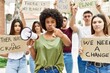 © Krakenimages.com - Group of young friends protesting and giving slogans at the street pointing with finger to the camera and to you, confident gesture looking serious