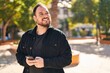 © Krakenimages.com - Young hispanic man smiling confident using smartphone at park