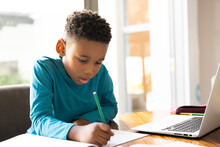 Image Of African American Boy Learning And Using Laptop