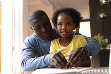 Image Of Happy African American Father And Daughter With Sight Disability Reading In Braille