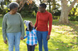 © wavebreak3 - Image of happy african american three generation women in garden