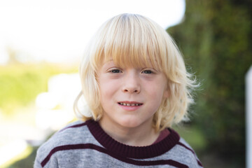 Image of happy caucasian boy smiling at camera