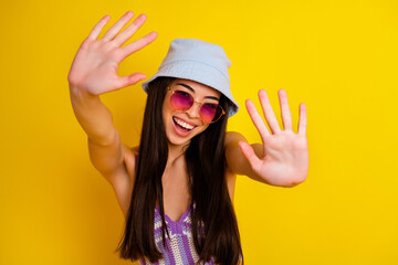 Photo of excited pretty lady wear striped crop top cap showing two palms ten fingers isolated yellow color background