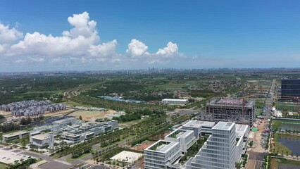 Wall Mural - Aerial Video of Haikou City Jiangdong New District, an International Hub for Retail, Residential, Leisure, Workplace, and Transportation in Hainan Free Trade Zone, Hainan Province, China, Asia.