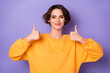 canvas print picture Portrait of charming satisfied girl two arms fingers demonstrate thumb up approve isolated on purple color background
